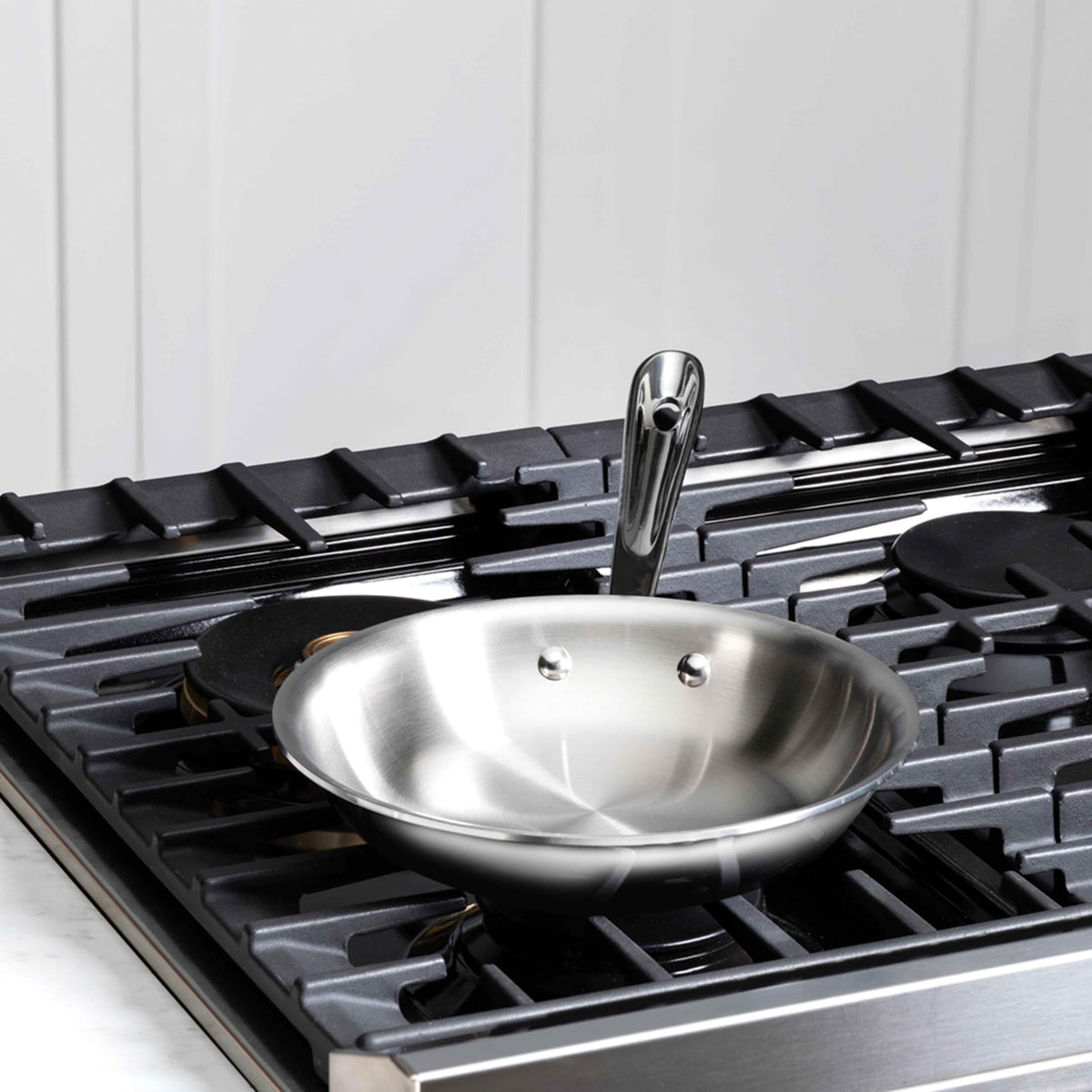All-Clad D3 riveted handle provides balanced control during cooking