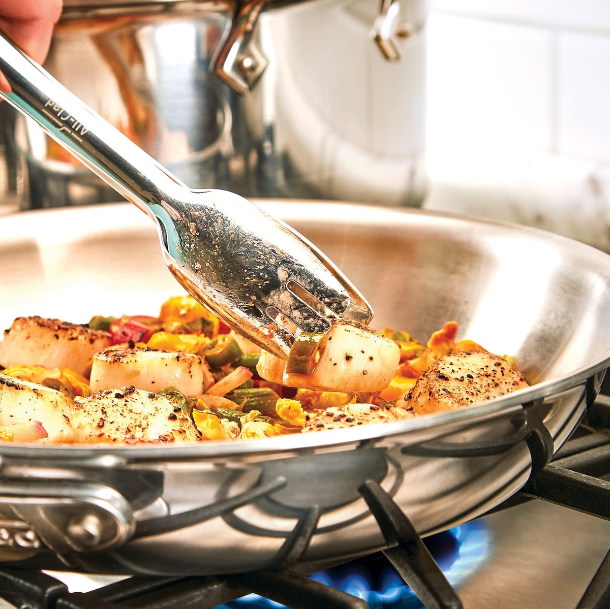 All-Clad dishwasher-safe tongs simplify cleanup after family meals.