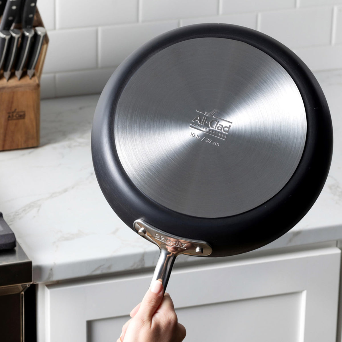 All-Clad HA1 grill pan features a durable base for even heating and warp resistance.
