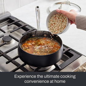Even-heat base of All-Clad HA1 Expert saucepan supports consistent cooking.