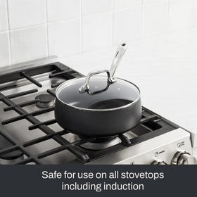 Induction-compatible All-Clad HA1 Expert saucepan for versatile cooking surfaces.