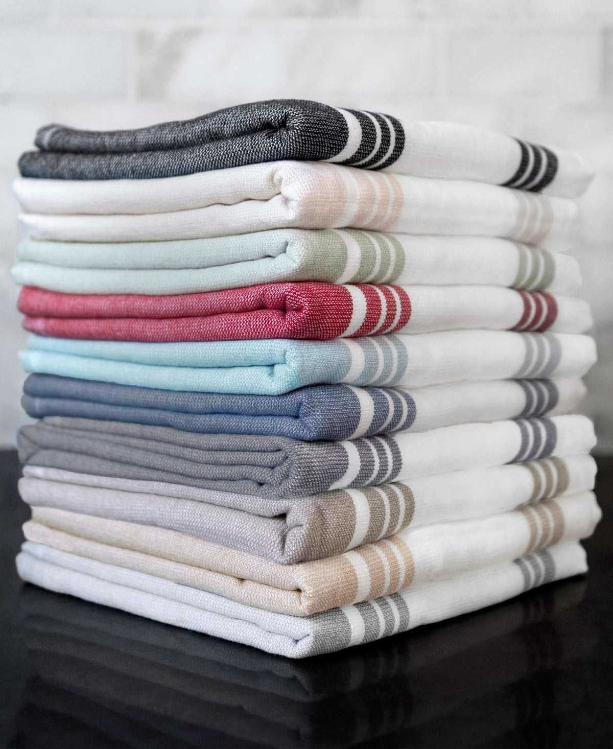 All-Clad kitchen towels are 25 percent larger for versatile cleaning tasks.