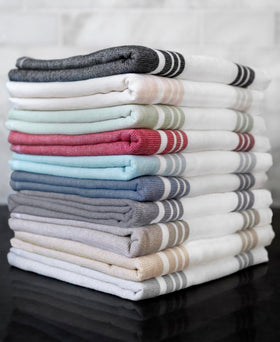All-Clad kitchen towels are 25 percent larger for versatile cleaning tasks.