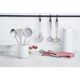 All-Clad locking tongs with scalloped heads provide a firm grip during cooking.