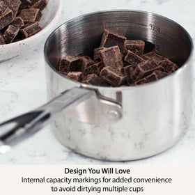 All-Clad measuring cups in use during baking for precise ingredient measurements.