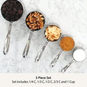 Nestable All-Clad measuring cups stored neatly in a compact stack.
