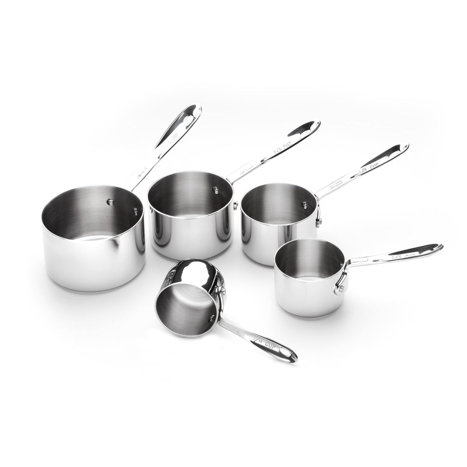 All-Clad measuring cups set inside a flour bag showing compact form for easy baking prep.