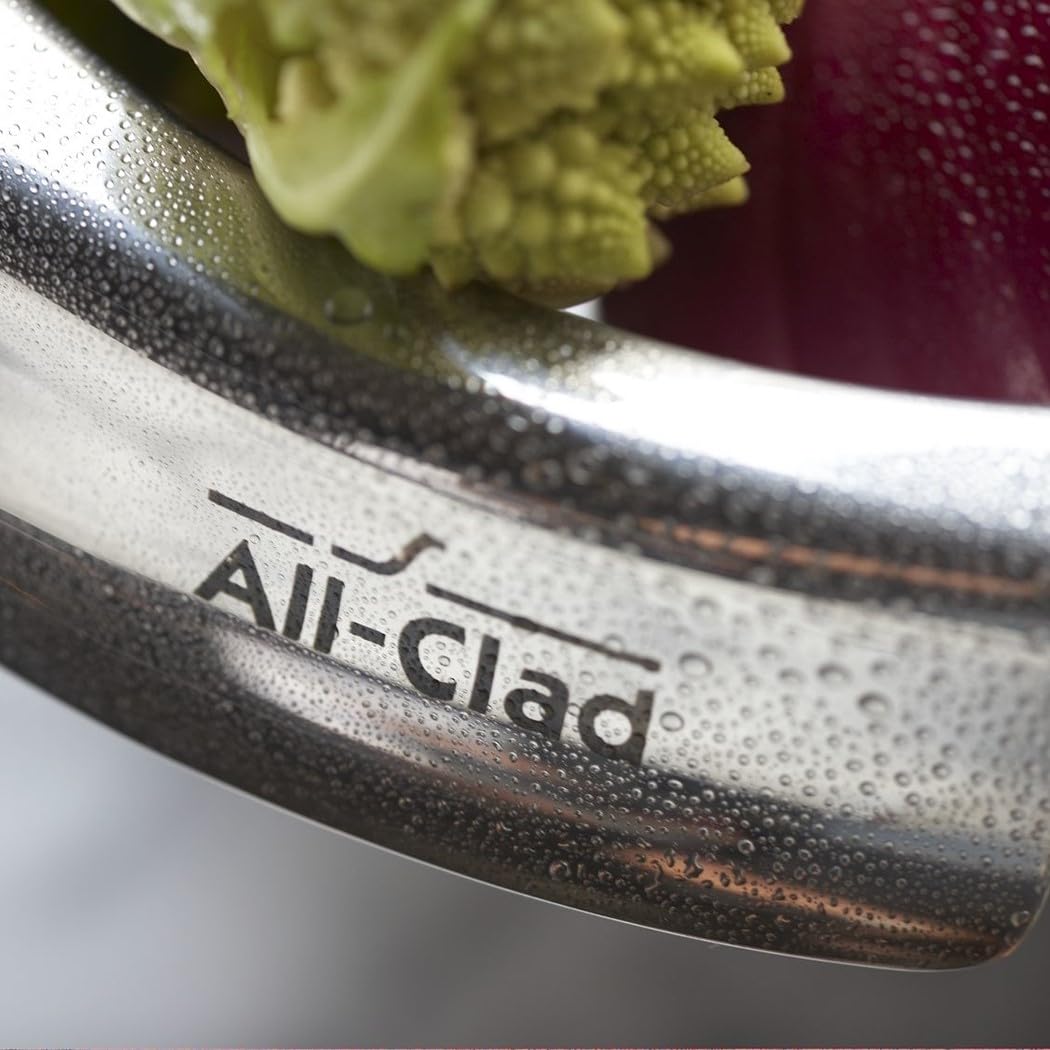 All-Clad mixing bowls integrated handles close-up, firm grip for whisking.