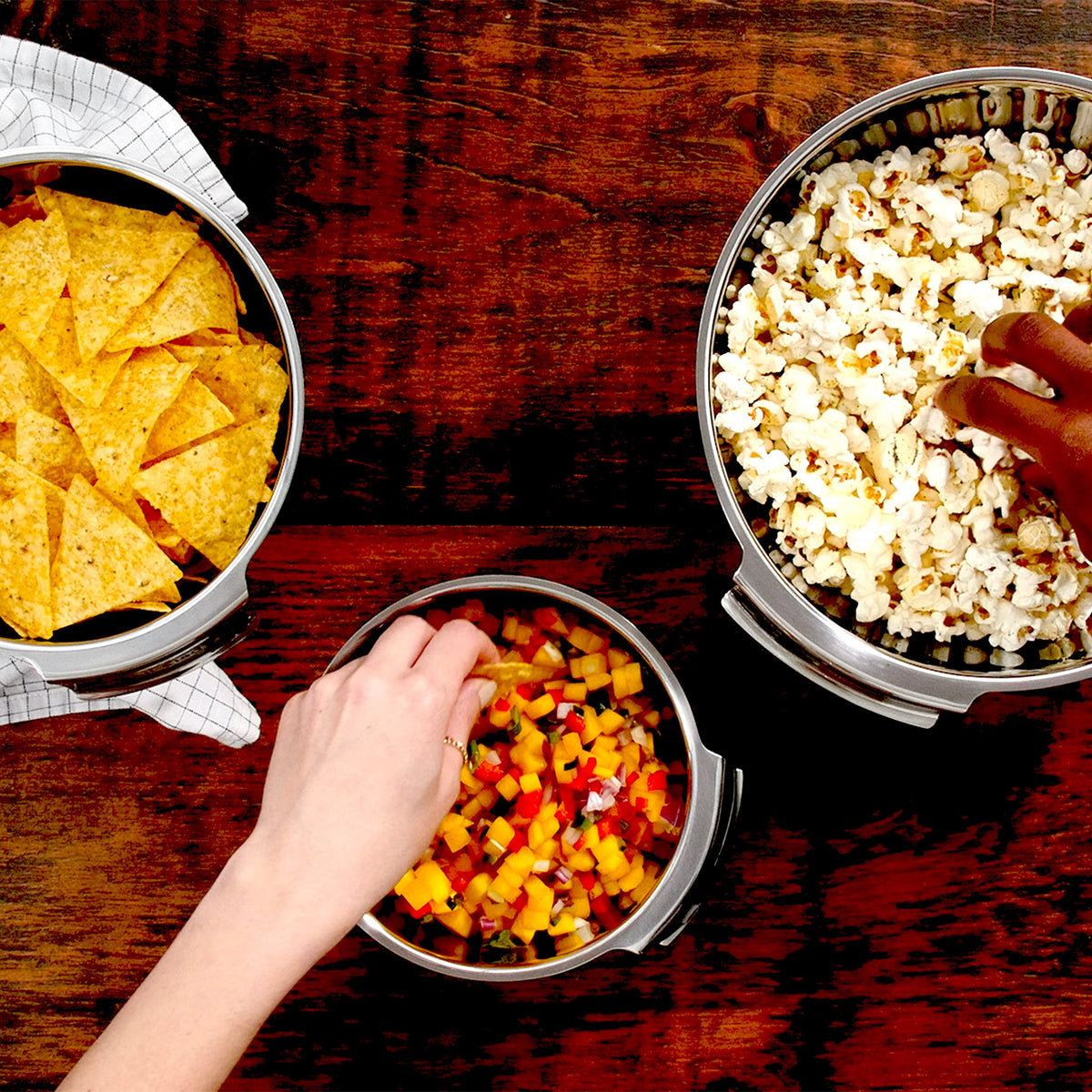 All-Clad mixing bowls nesting design illustrates space-saving storage.