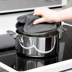 All-Clad pot holder coordinates with kitchen textiles for a cohesive set.