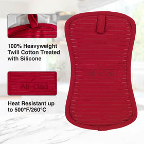 All-Clad pot holders gripping a hot dish with confidence from oven to table.