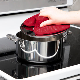All-Clad Chili Red pot holders add vibrant color to kitchen and outdoor setup.