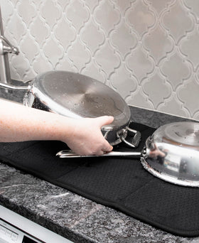 Close up of All-Clad mat soaking moisture from washed dishes