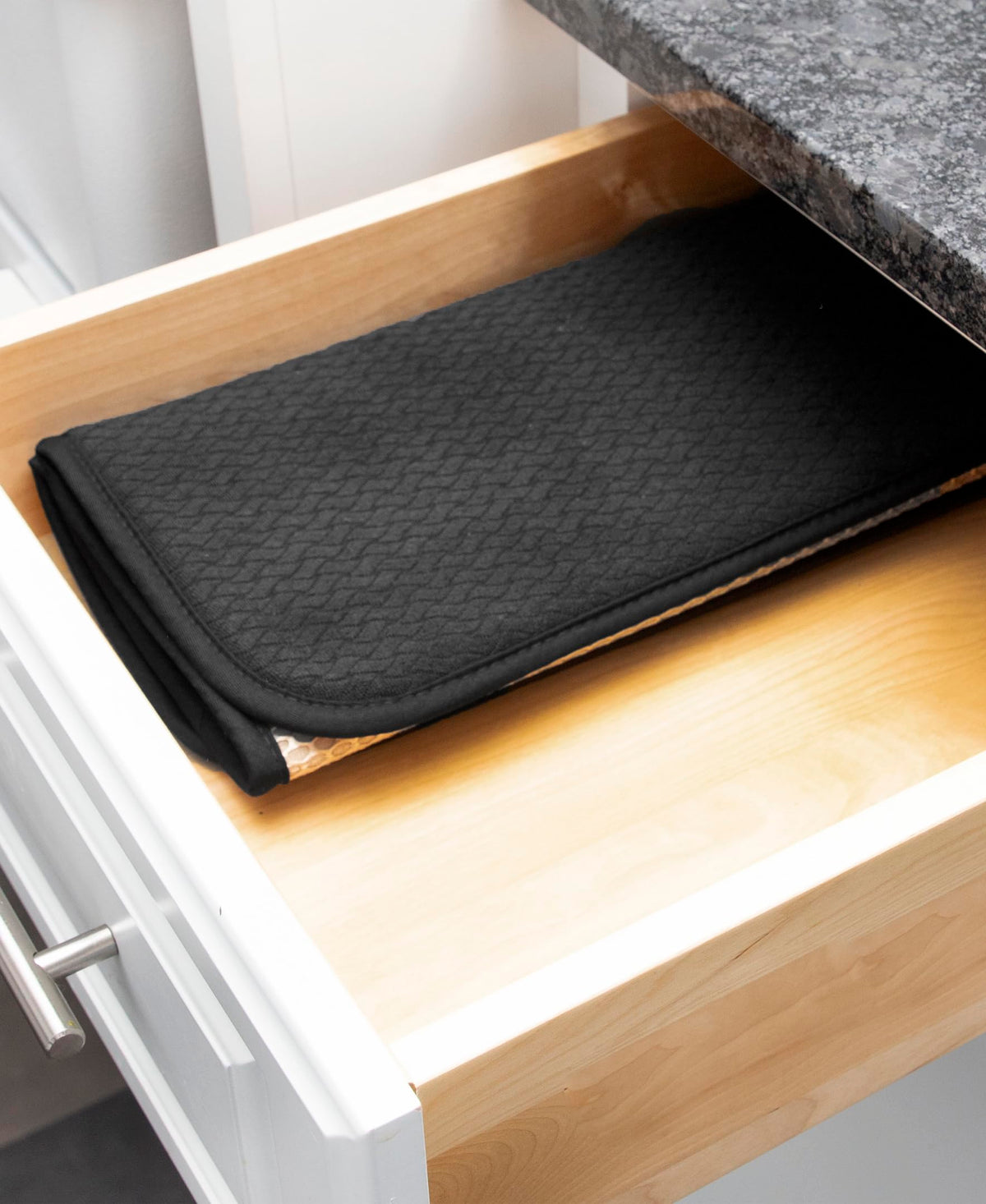 Machine-washable All-Clad mat ideal for large pots and pans
