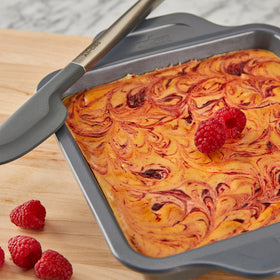 All-Clad Pro-Release 8x8 pan with rounded corners supports clean slicing and uniform browning.