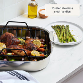 All-Clad roaster upright handles provide secure transport from oven to tray.