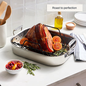 All-Clad roaster safe in oven and broiler up to 600°F for versatile cooking.
