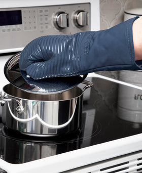 All-Clad indigo oven mitts with extended length for forearm protection.