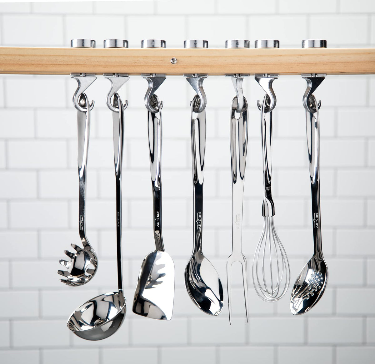 All-Clad slotted turner drains grease while lifting foods.