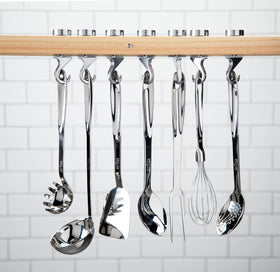 All-Clad slotted turner drains grease while lifting foods.