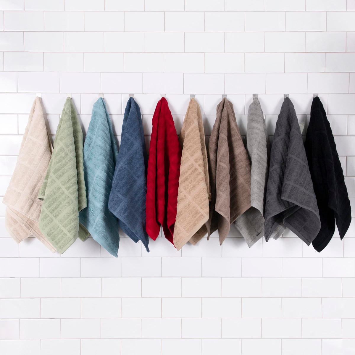 All-Clad Solid Kitchen Towels Indigo stacked on counter, convenient reusable alternative