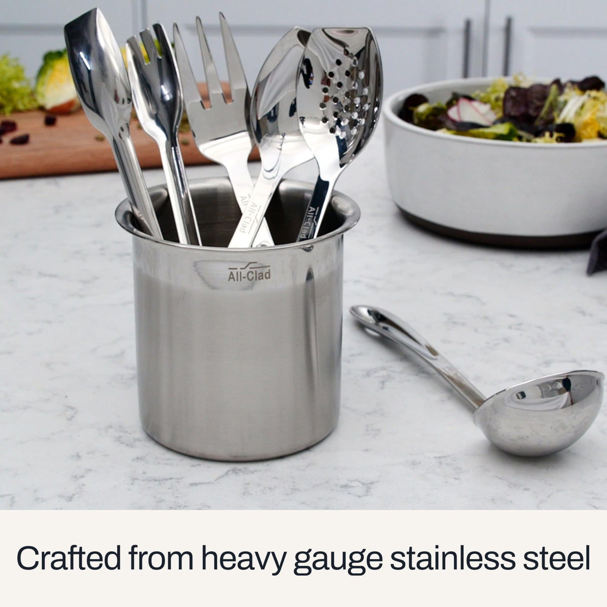 All-Clad ladle shows a hang loop for easy storage near the stove.