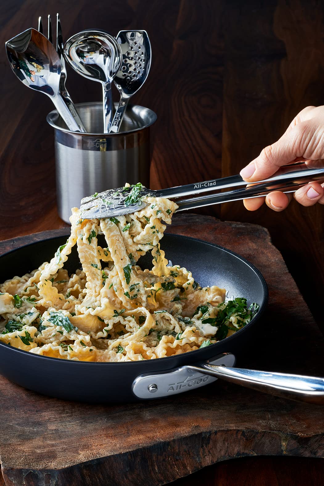 All-Clad tongs feature a mirror-polished finish to complement cookware.