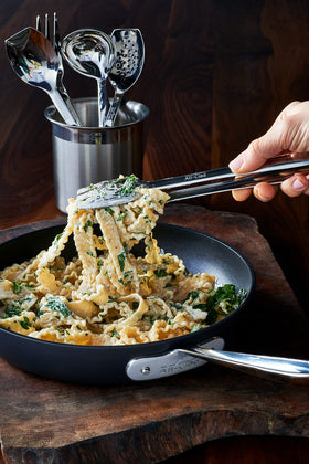 All-Clad tongs feature a mirror-polished finish to complement cookware.