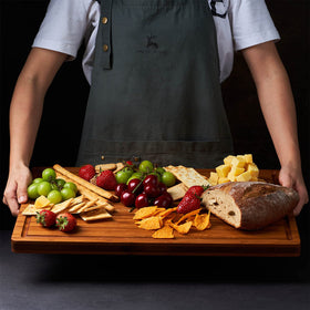 Allsum XL cutting board side view focusing on handles for transport