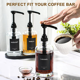 Black tray keeps ALPIRIRAL syrups neatly arranged at the counter.