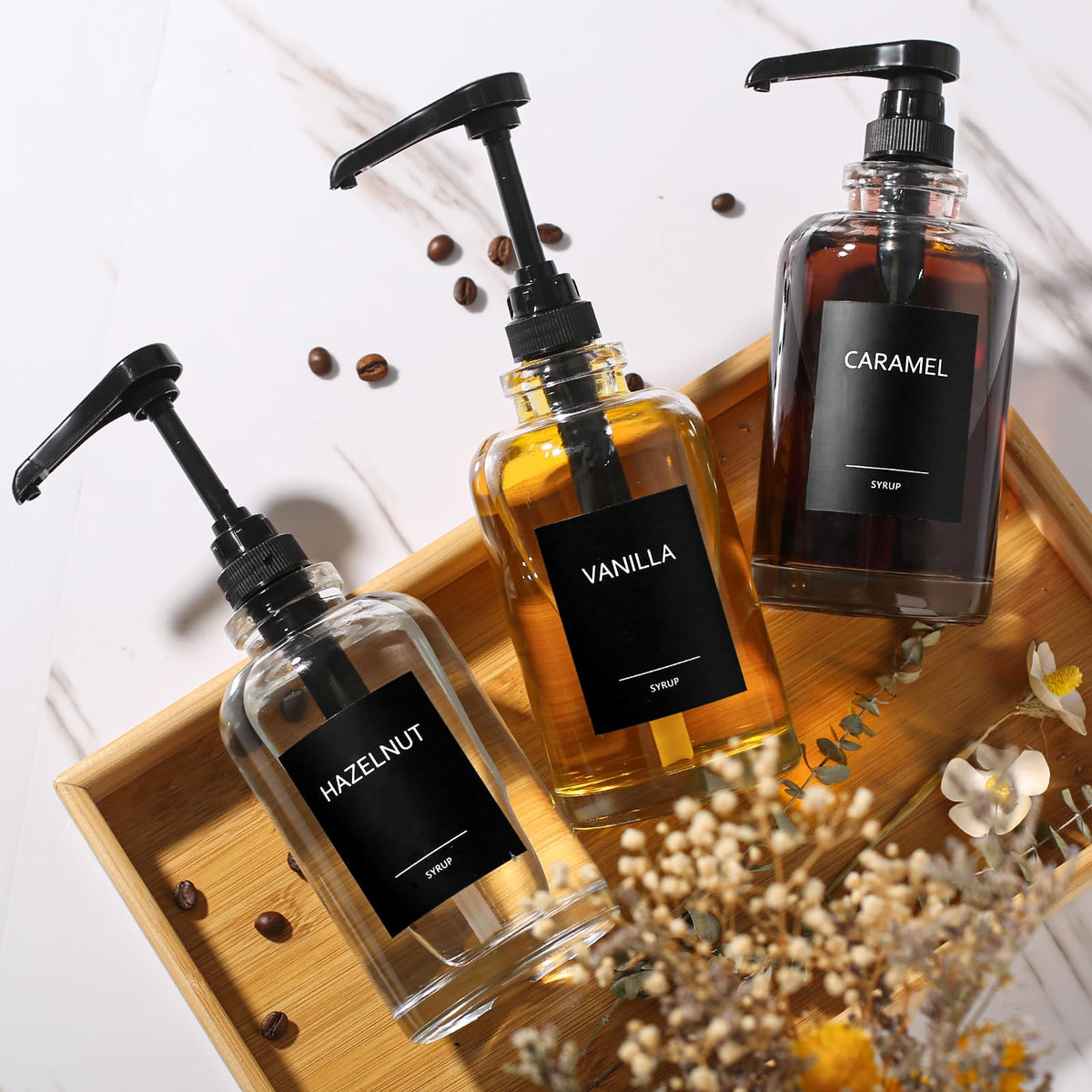 ALPIRIRAL syrup bottles organized on a coffee bar organizer.