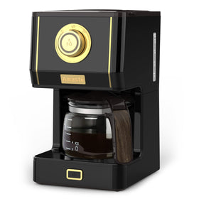 Amaste coffee maker with compact footprint on a kitchen counter.