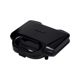 Amazon Basics 2-Slice Waffle Maker closed for even browning and compact storage.