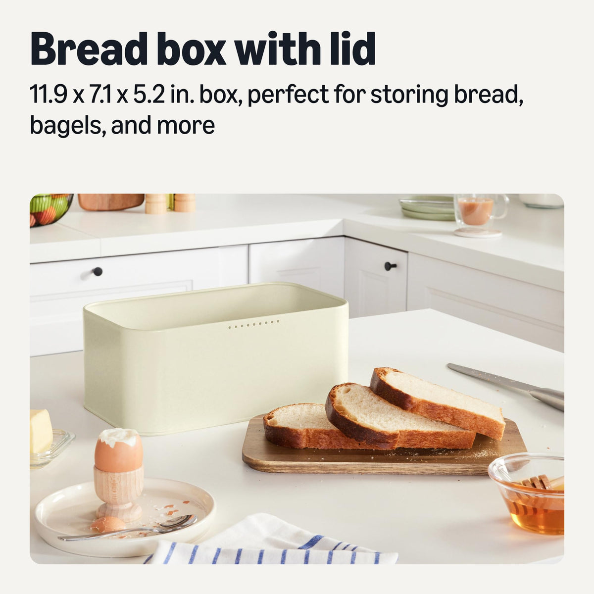 Amazon Basics bread box with acacia lid doubles as cutting board for bread prep.