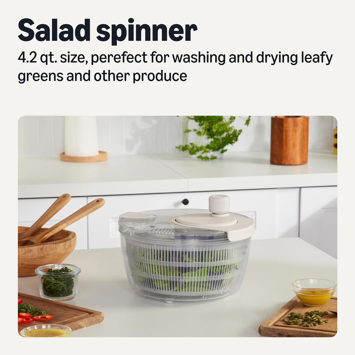 Amazon Basics salad spinner draining lid allows water to drain without removing the lid.