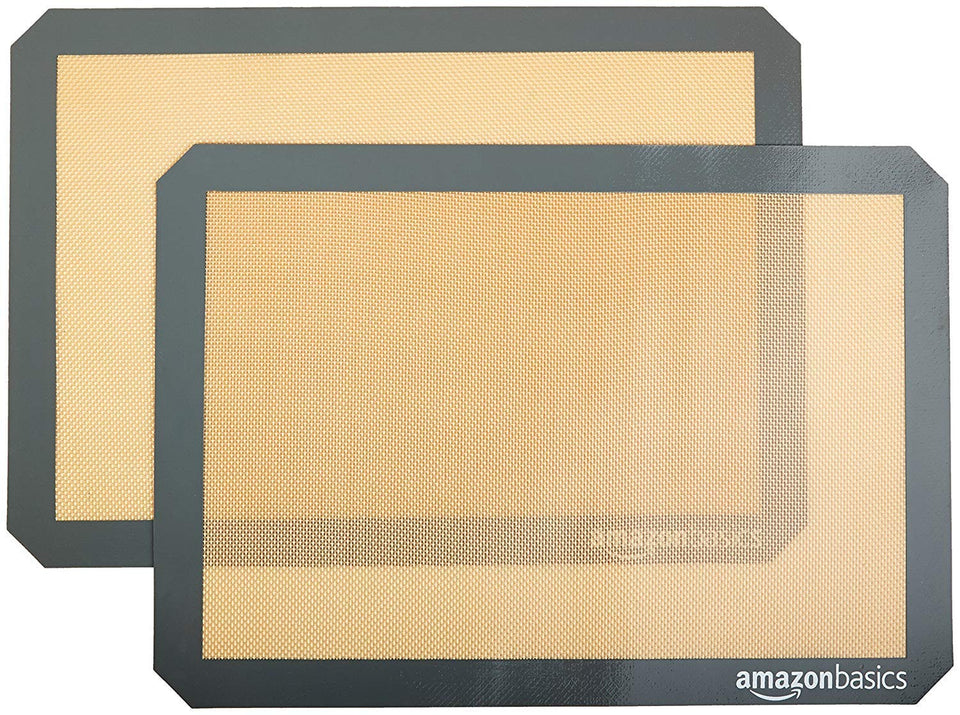 Amazon Basics silicone baking mat, rectangular beige-gray, fits standard trays.