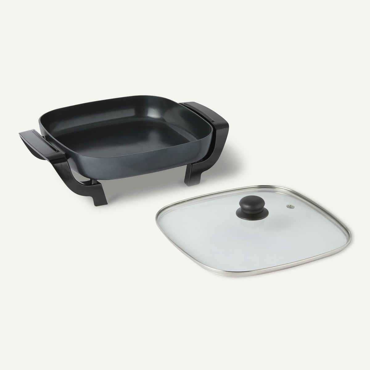 Amazon Basics skillet displaying adjustable heat options for versatile cooking