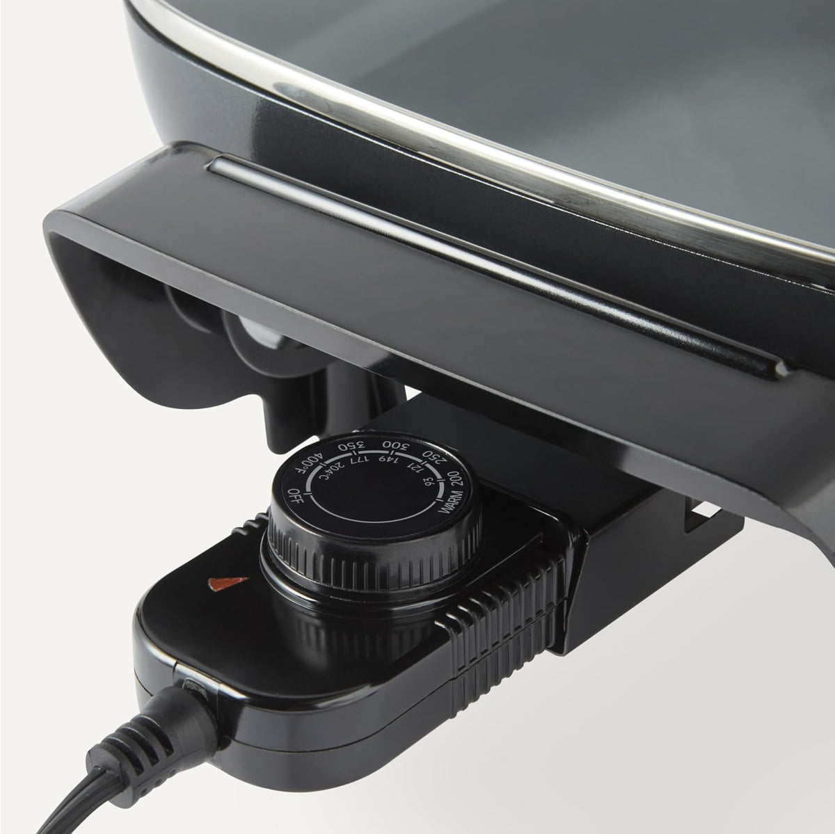 Amazon Basics skillet featuring cool-touch handles for safe lifting and transport