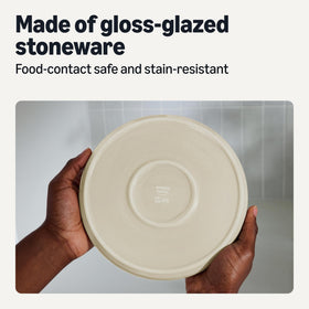 Amazon Basics stoneware plates and bowls arranged on table for versatile dining.