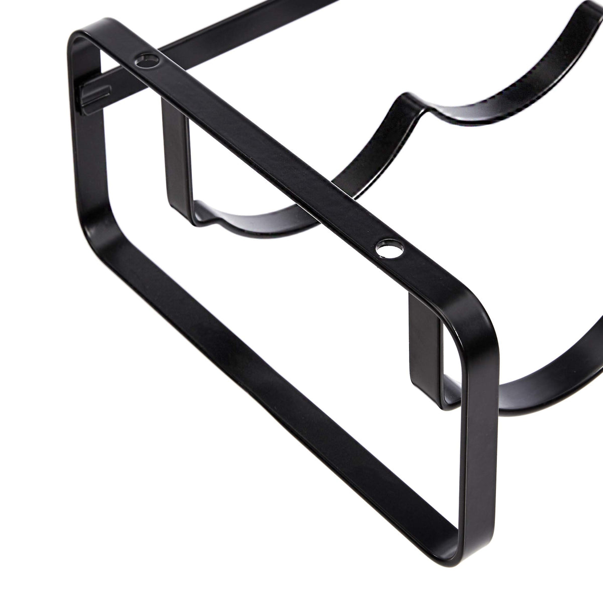 Amazon Basics black metal wine rack on a counter displaying durable steel construction.