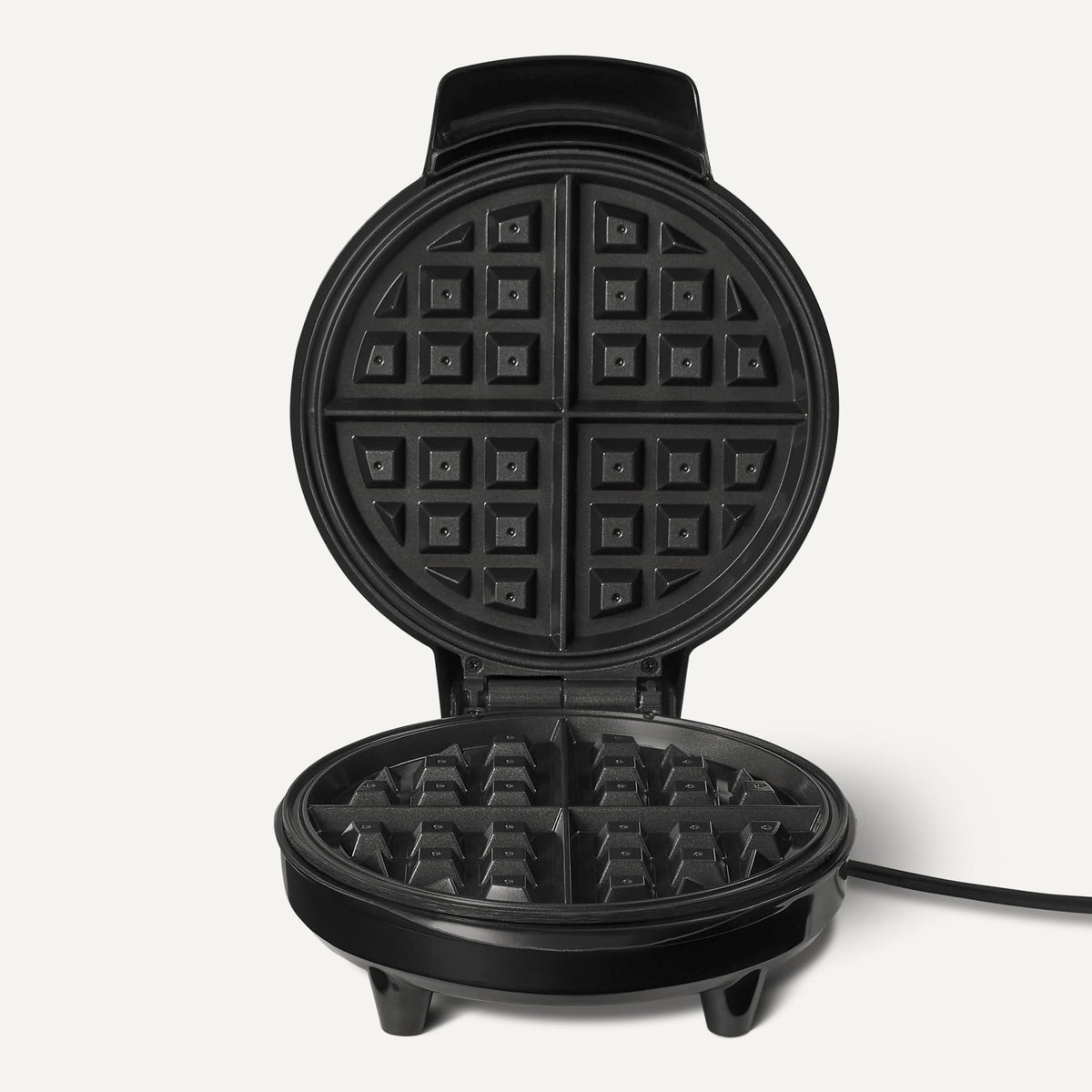 Amazon Basics waffle iron cool touch handle for safe, comfortable lifting.