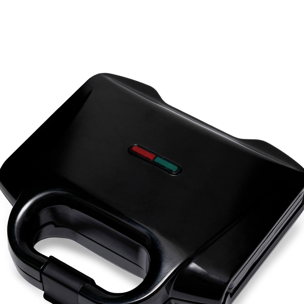 Indicator lights on the Amazon Basics waffle maker guide cooking progress.