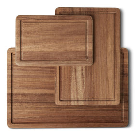 Amazon Basics acacia cutting board trio laid out for meal prep and serving.