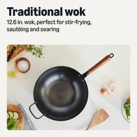 Amazon Basics wok features a cool-touch acacia handle for comfortable cooking.