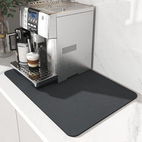 AMOAMI Coffee Mat with absorbent diatomite soaking up spills quickly.