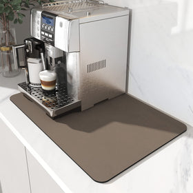 AMOAMI coffee mat under the coffee maker showing hide-stain capability for a tidy counter.