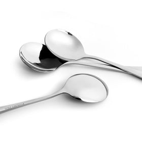 AmoVee spoons being loaded in dishwasher for easy cleanup.