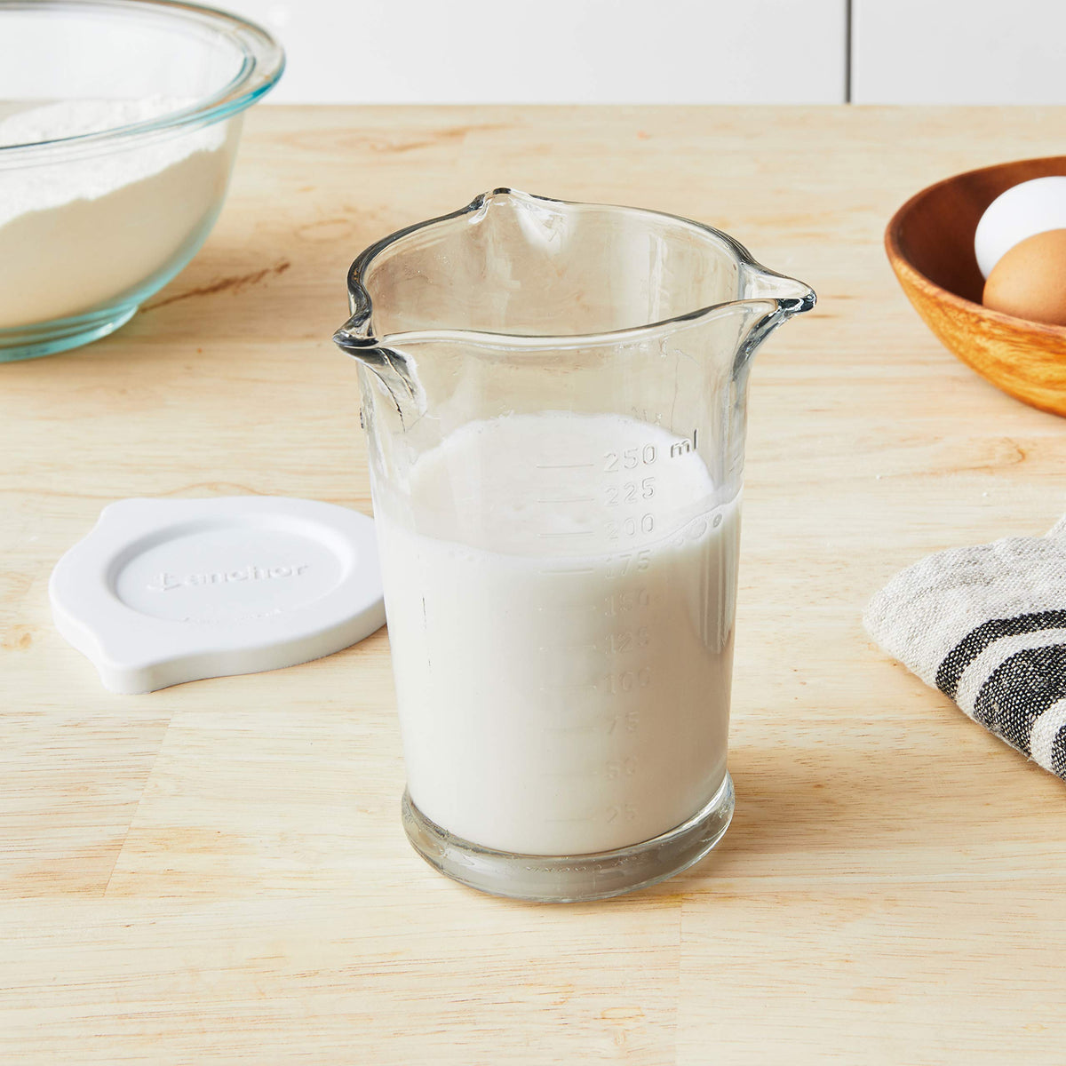 Anchor Hocking 8oz glass measuring cup featuring three pours for precise liquid transfer.