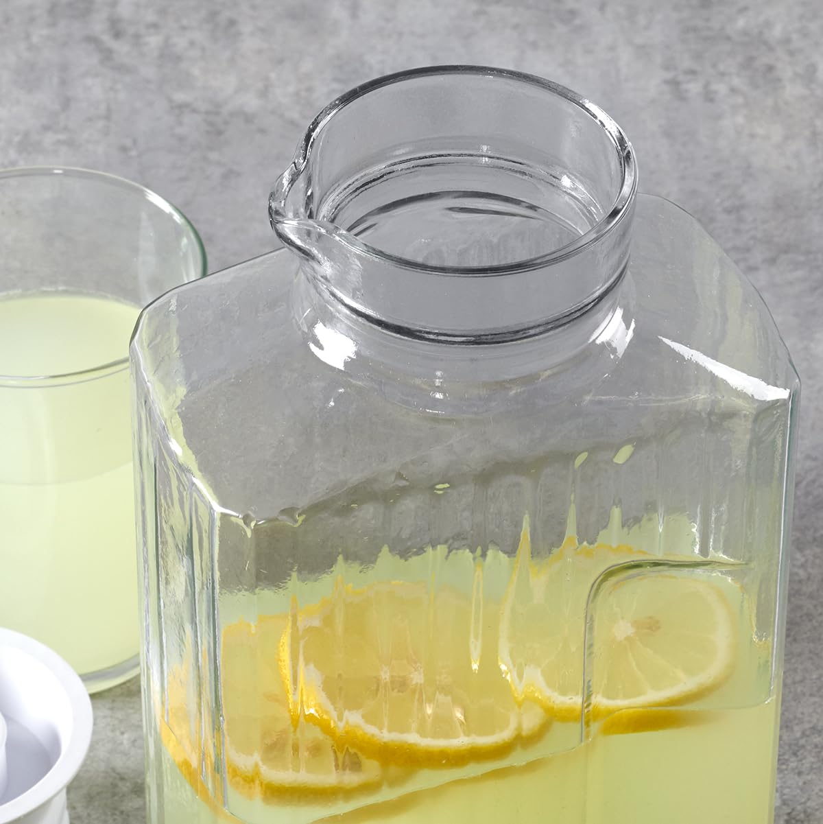 Anchor Hocking Bistro Pitcher crystal-clear glass enhances colorful drinks.