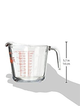 Anchor Hocking Fire-King glass measuring cup shows red measurement guide for quick readings.